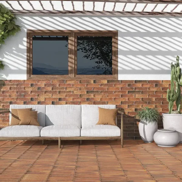 Terracota tile manufacturers catalogue´s picture showing a warm style terrace with plants  