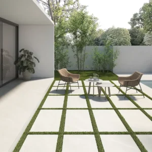 Picture of white big flooring tiles on a modern patio