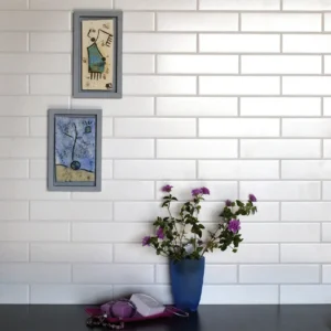 Wall coated with white subway tiles 