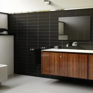 Black subway tiles set on an urban look restroom 